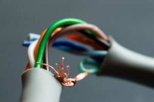 A closeup shot of a broken UTP ethernet cable